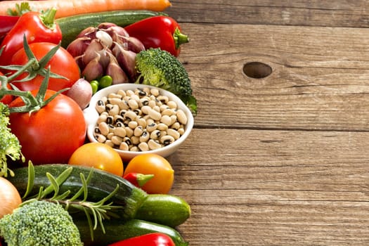 Black eyed peas in a bowl and vegetables