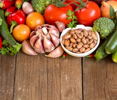 Pinto beans in a bowl and vegetables