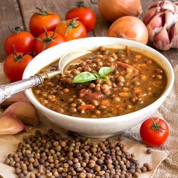 Cooked roveja stew with cherry tomatoes, garlic and onion