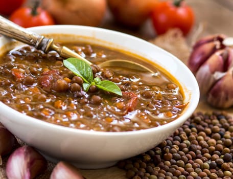 Cooked roveja stew with cherry tomatoes, garlic and onion