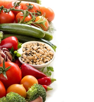 Black eyed peas in a bowl and vegetables