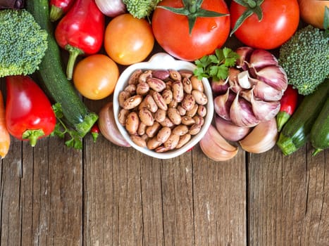 Pinto beans in a bowl and vegetables