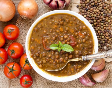 Cooked roveja stew with cherry tomatoes, garlic and onion