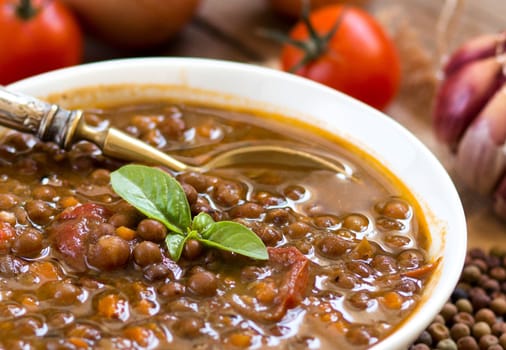 Cooked roveja stew with cherry tomatoes, garlic and onion