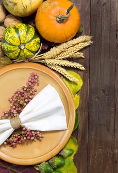 Rustic autumn table setting on wooden table