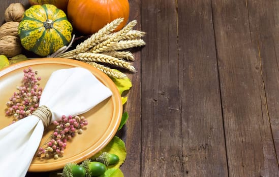 Rustic autumn table setting on a wooden table