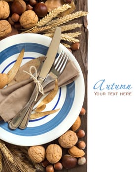 Autumn table setting with nuts and wheat