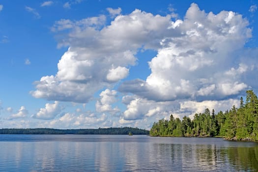 Cumulus Clouds over the North Woods on Saganagons Lake in Quetico Provincial Park in Canada