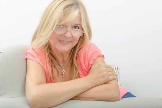 Portrait of mature woman relaxing in sofa