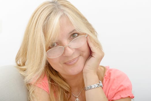 a portrait of mature smiling blond woman