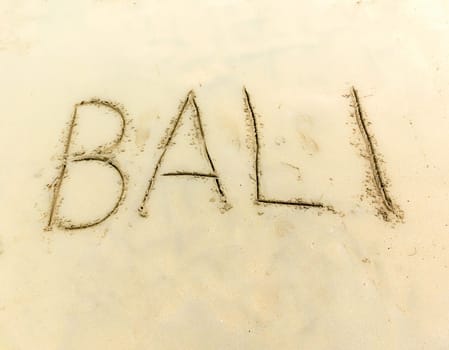 The inscription on and from the sand Bali .