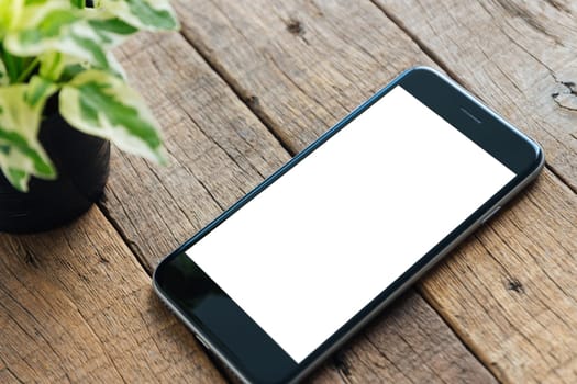 close up phone white screen on wood desk
