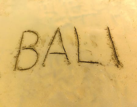 The inscription on and from the sand Bali .