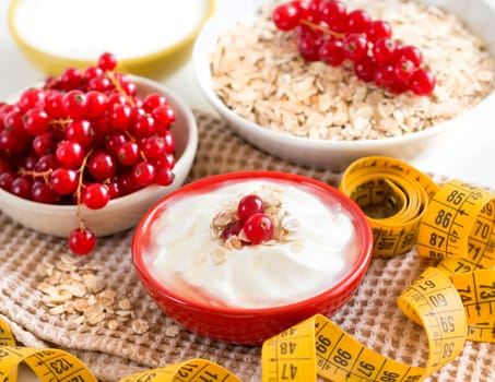 Healthy breackfast - cereals with red currants and yogurt