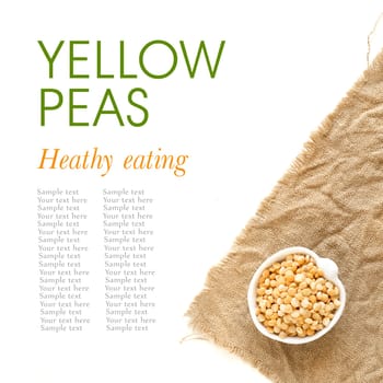 Raw yellow peas in a bowl on burlap