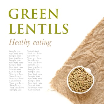 Raw green lentils a in a bowl on burlap