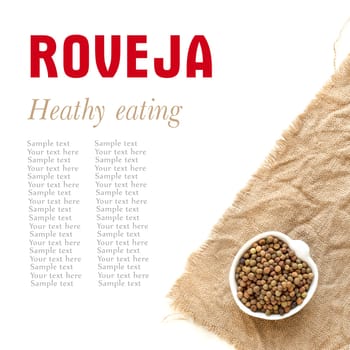 Raw roveja in a bowl on burlap