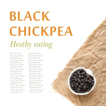 Raw black chickpea in a bowl on burlap
