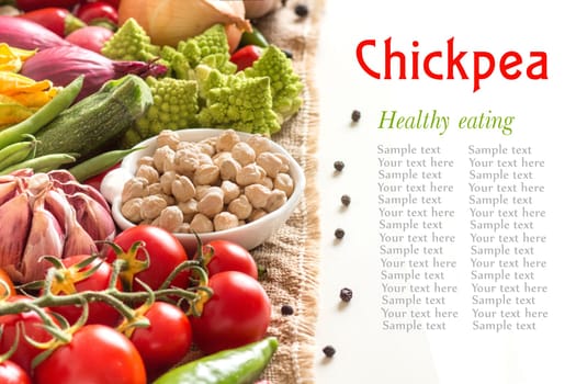 Chickpea with vegetables on burlap isolated on white