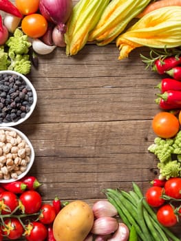 Vegetables and chickpea on a wooden table background