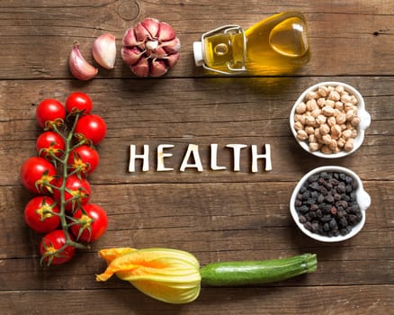 Vegetables and chickpea on a wooden table background