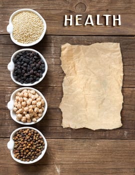 Cereals and legumes in bowls on a wooden table