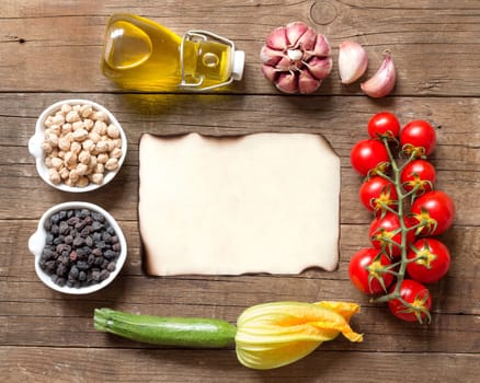 Vegetables and chickpea on a wooden table background
