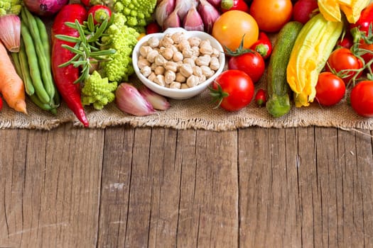 Dried organic chickpea in a bowl and vegetables