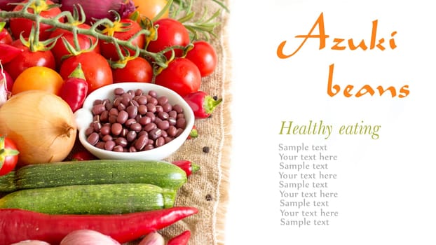 Dry organic azuki beans in a bowl and vegetables