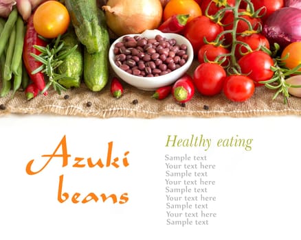 Dry organic azuki beans in a bowl and vegetables