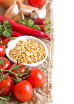 Vegetables and yellow peas on a white background