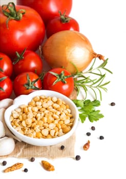 Vegetables and yellow peas on a white background