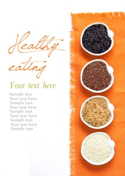 Black, red wild rice, basmati and unpolished whole rice in bowls