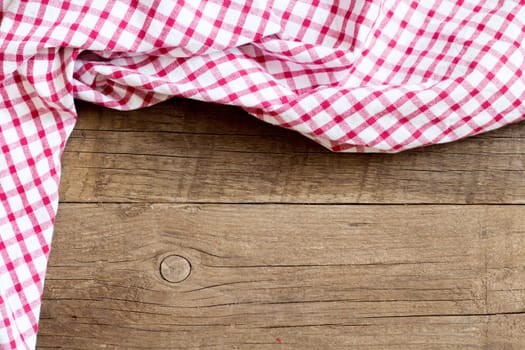 Checkered tablecloth on the old wooden table