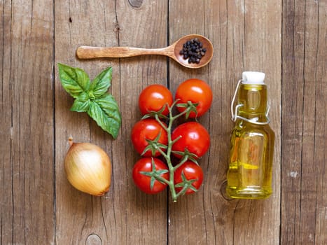 Ingridients for italian tomato sauce- tomatoes, onion, basil, extra vergin olive oil and pepper