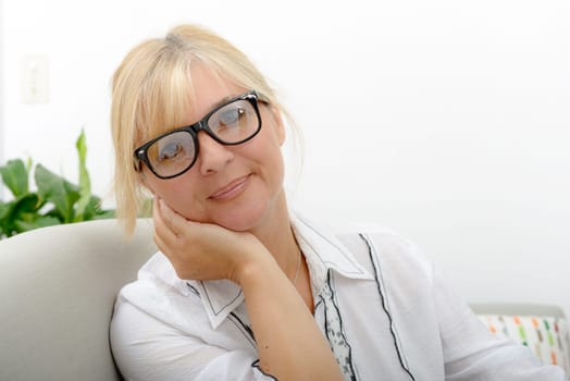 a portrait of mature smiling blond woman