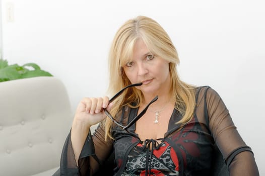 a portrait of mature smiling blond woman