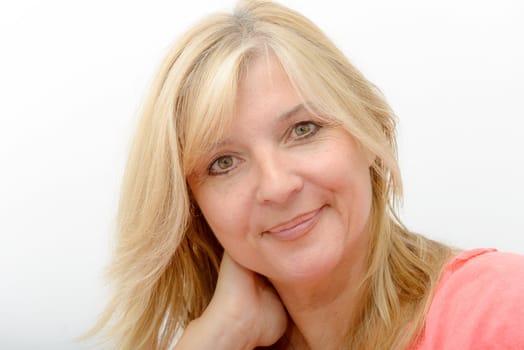 Portrait of blond mature woman relaxing at home