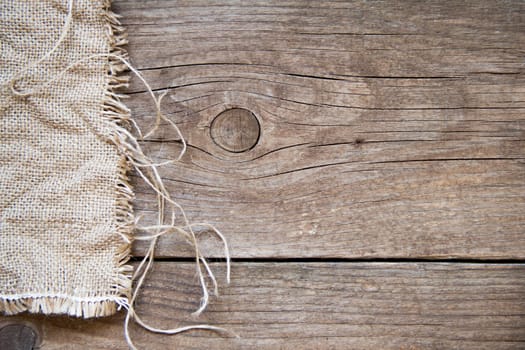 Burlap and dark wood background