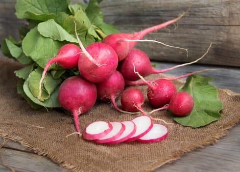 Fresh radish on burlap background
