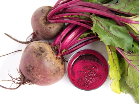 Fresh juice of red beets on white