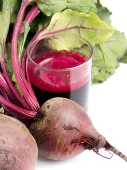 Fresh juice of red beets on white