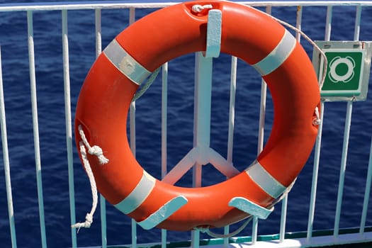 Orange Life Buoy On The Deck Of A Cruise Ship.