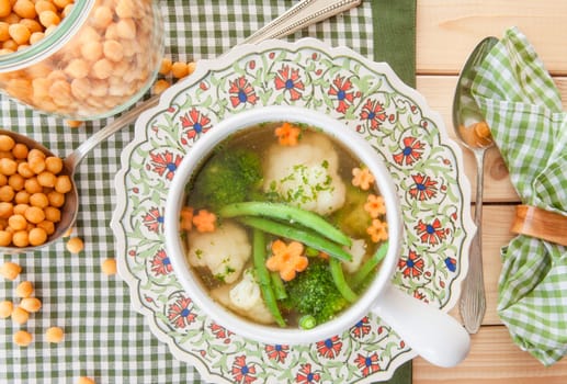 Rustic soup with fresh colorful vegetables