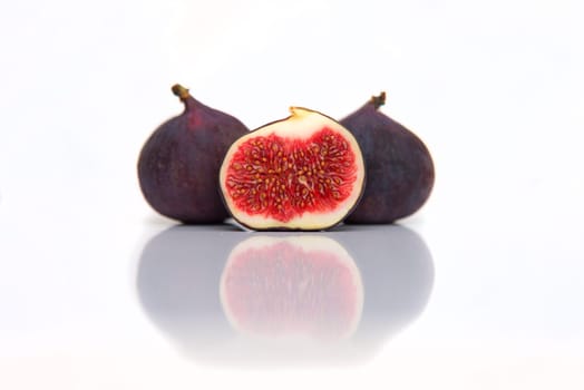 fresh figs isolated on white with reflection
