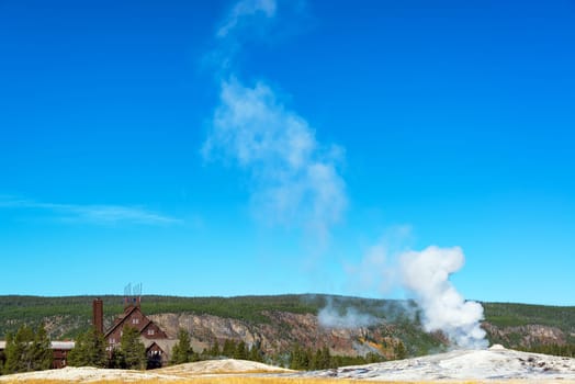 View of Old Faithful geyser and lodge in Yellowstone National Park