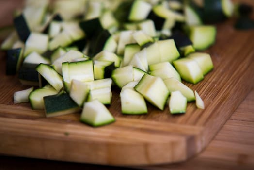 close up on zucchini pieces on wood