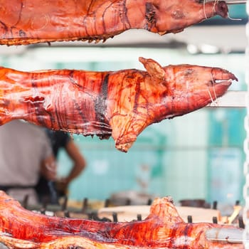 Baked roasted pork carcasses on the barbecue.