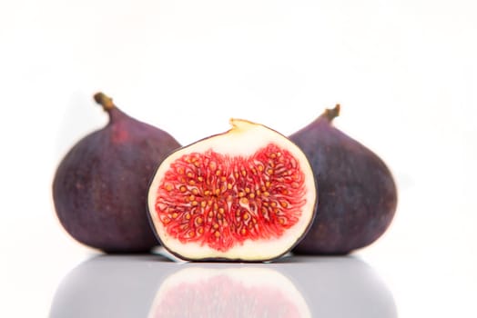 fresh figs isolated on white with reflection