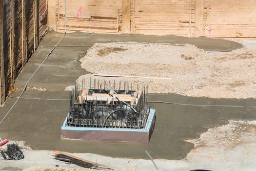 Foundation construction made of steel and concrete for the construction of an apartment building with underground parking. .